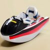 Rush Wave 2025 15 kW Electric Go-Kart Boat, red stripe studio view Rush Wave 2025 15 kW Electric Go-Kart Boat with a white hull, red and black side stripes, black windshield, and white-and-blue seat in a studio view.