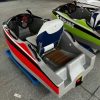 Rush Wave 2025 15 kW Electric Go-Kart Boat, rear interior with wood-look deck Rush Wave 2025 15 kW Electric Go-Kart Boat with a white-and-red hull, white-and-blue seat, wood-look rear deck, grab handles, steering wheel with red display, and rear jet outlet.