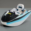 Rush Wave 2025 15 kW Electric Go-Kart Boat, blue stripe studio view Rush Wave 2025 15 kW Electric Go-Kart Boat with a white hull, light-blue and black side stripes, black windshield, and white-and-blue seat in a studio view.