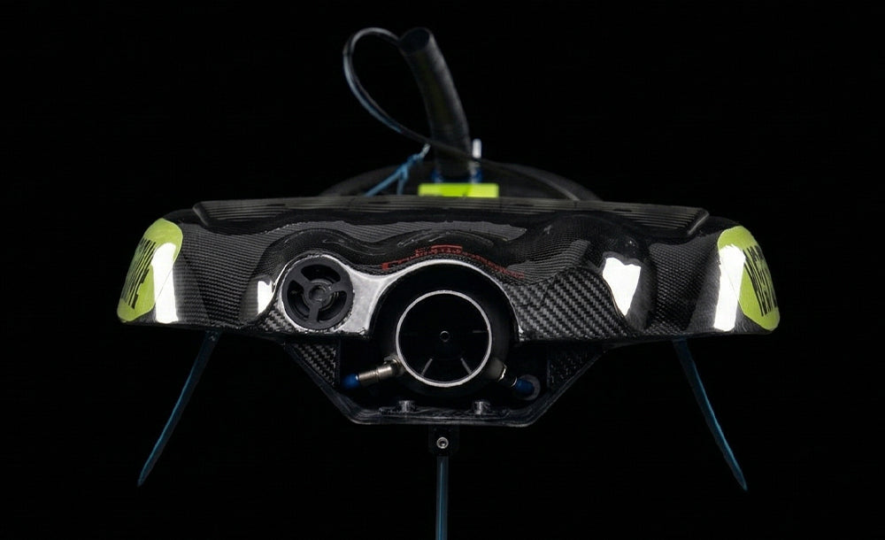 Rear of the carbon Raptor EFI 03, showing the jet intake, blue fins, and a looped hose.