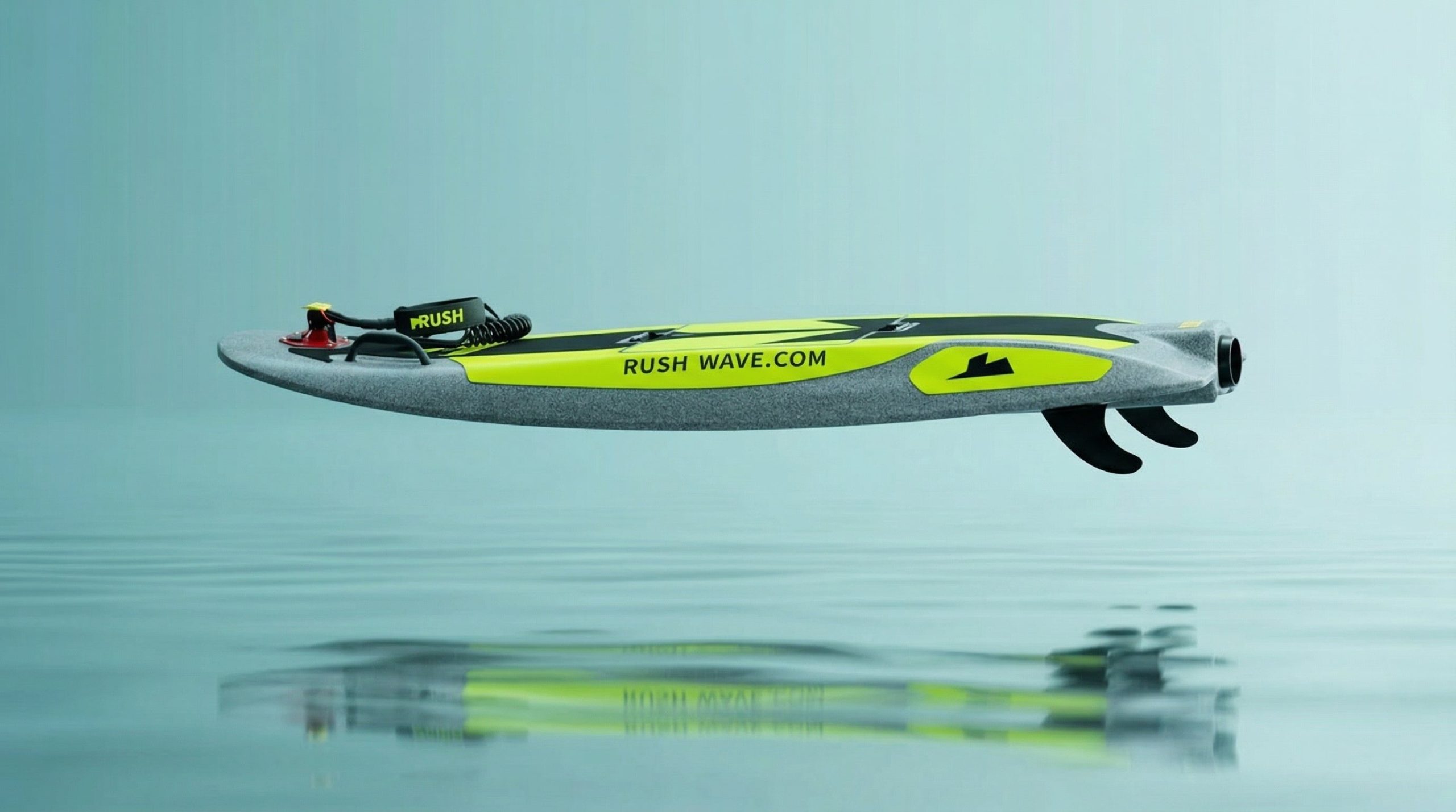 Side view of the gray and neon yellow Rider H1 with a coiled leash and three fins.