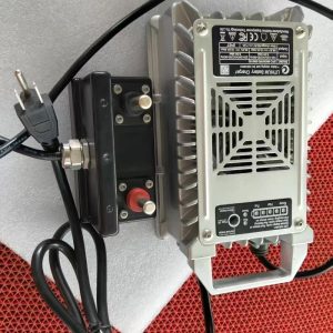 Rush Wave dedicated surfboard charger, a silver IP67 unit labeled 58.8 V with a black connector box.